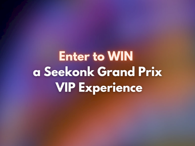 A blurred colorful background with white and orange text: &ldquo;Enter to WIN a Seekonk Grand Prix VIP Experience.&rdquo;