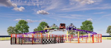 A looping roller coaster ride surrounded by a red and black fence, colorful cars on a bright day with blue sky and green trees.